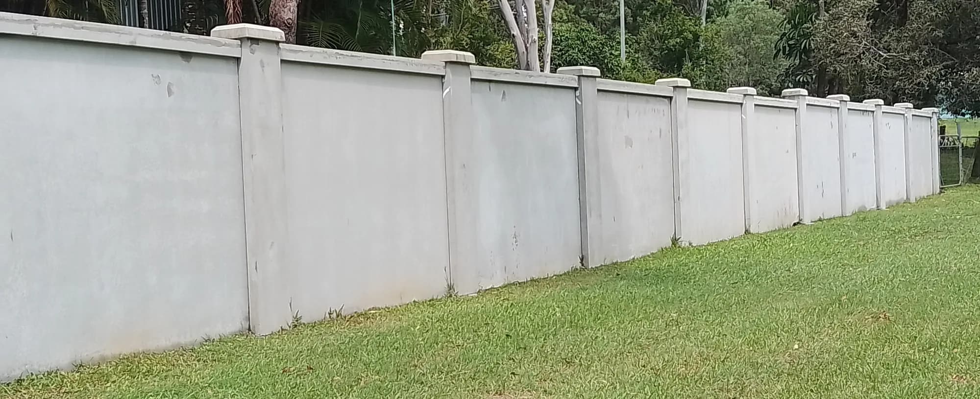 Panels and piers concrete fence style