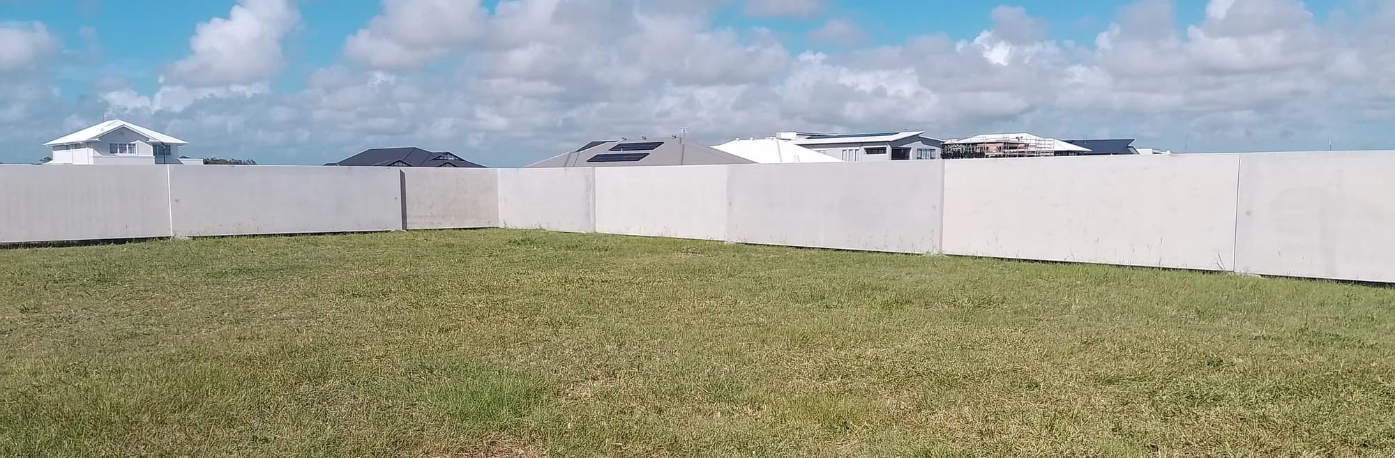 Solid concrete tilt panel boundary fence